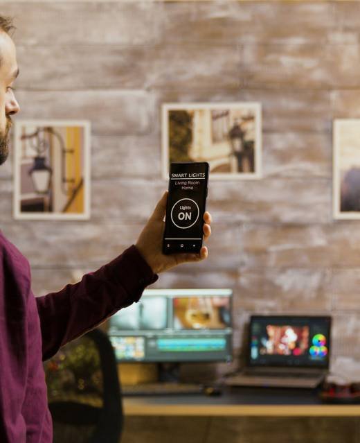 Using a smart light application to turn on the light bulbs in the house Using a smart light application to turn on the light bulbs in the house